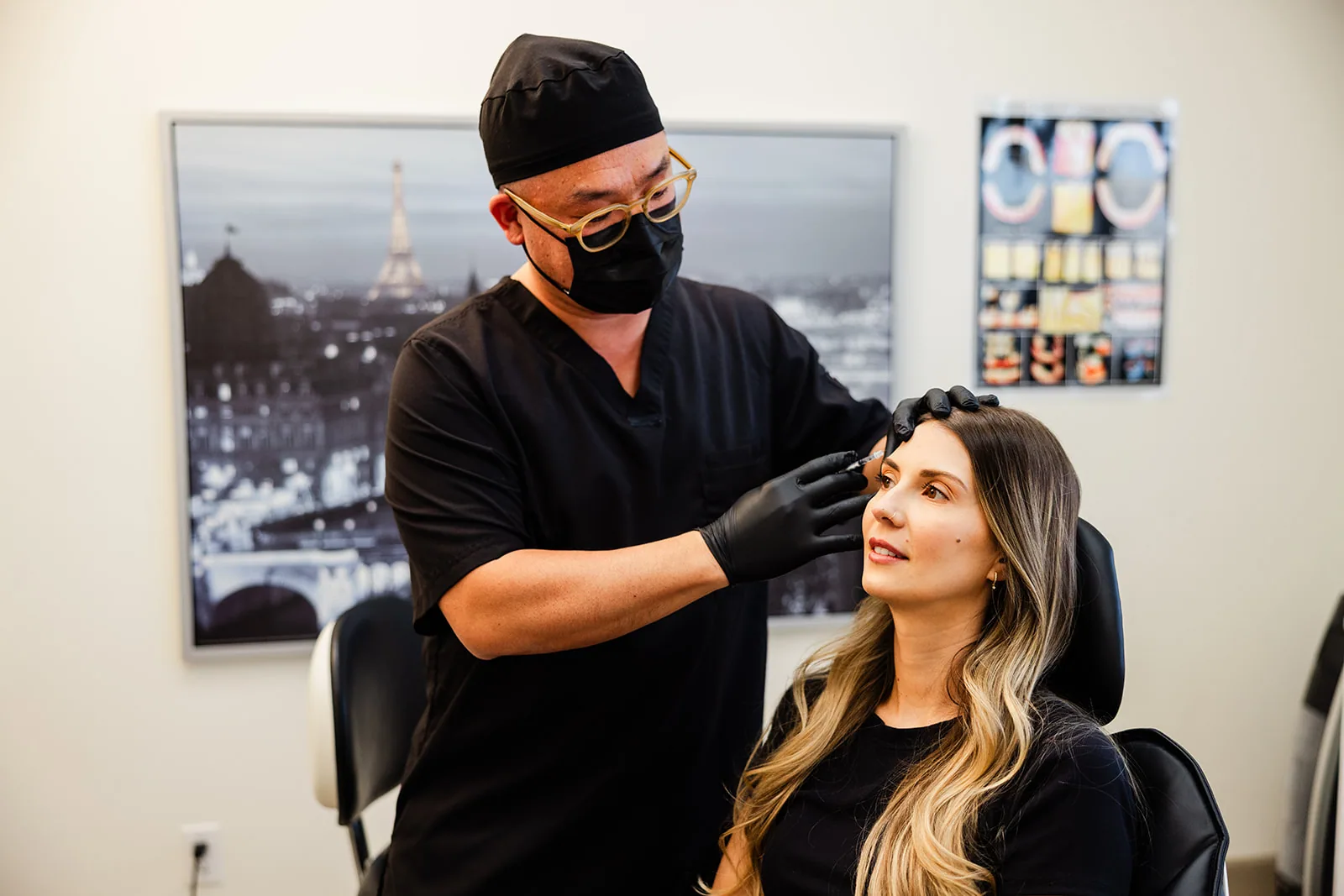 A dentist and patient reviewing treatment together in the surgery