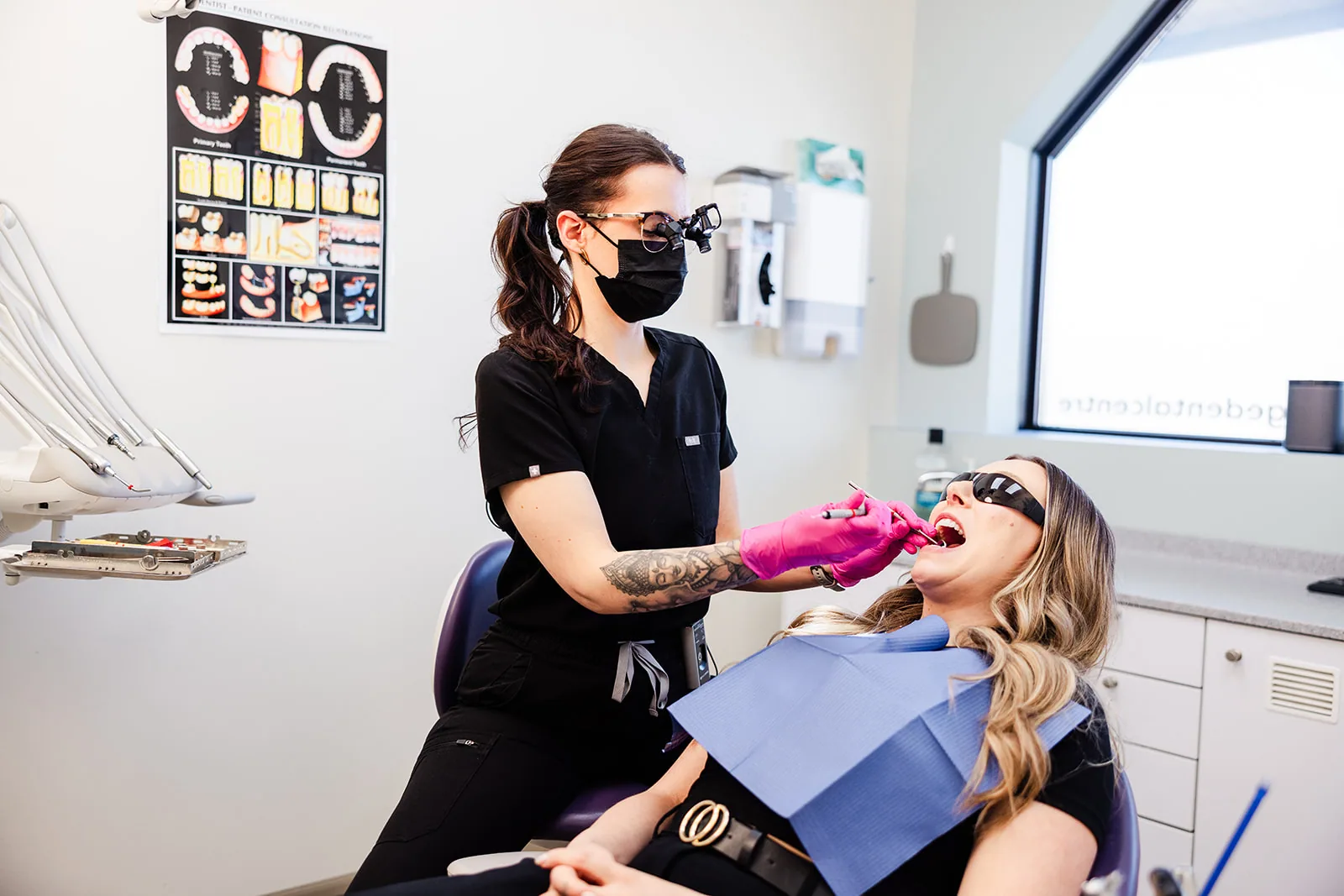 A hygienist working with a patient during a scale and polish